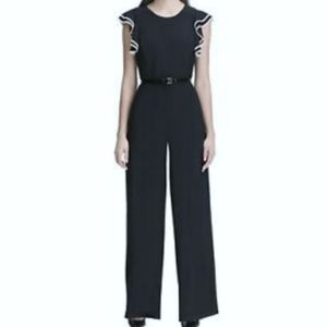 Deep navy jumpsuit with flutter sleeves
